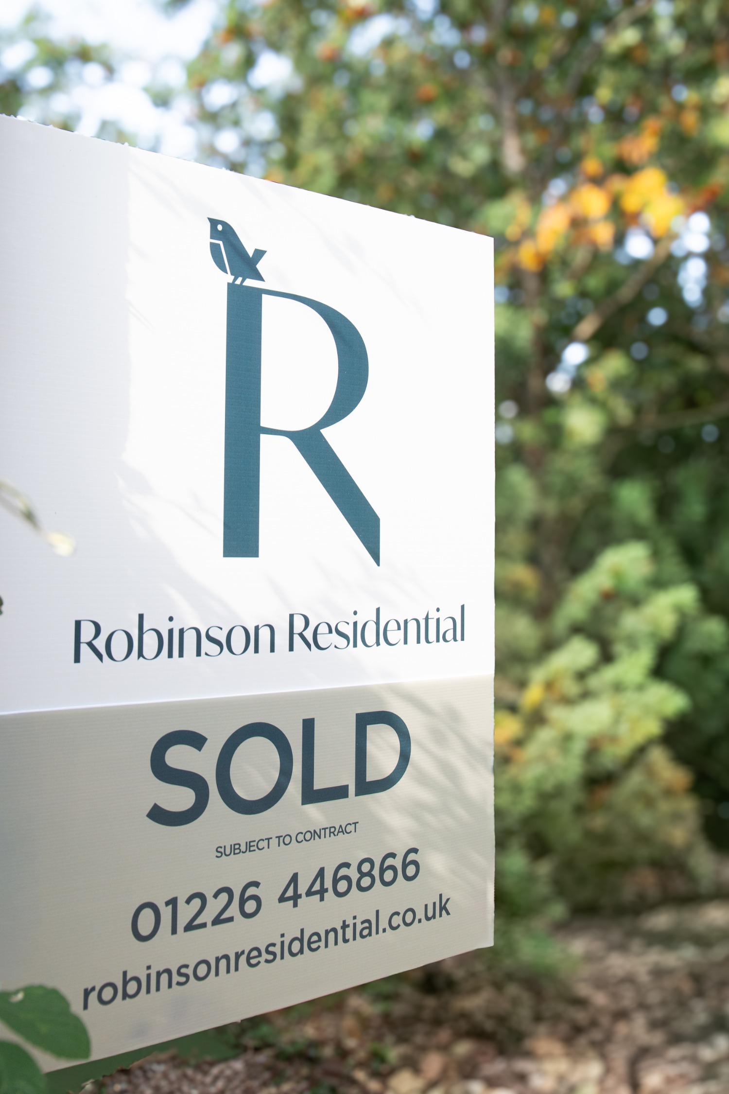 Robinson Residential sold sign with phone number and website